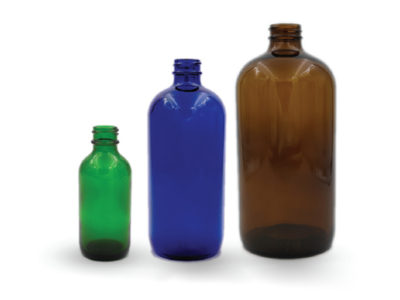 Various types and sizes of Boston round glass bottles used in packaging pharmaceuticals, essential oils, cosmetic products, and food items.