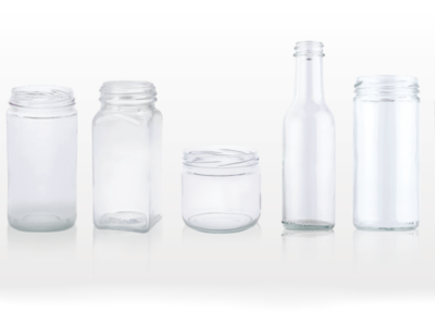 Various types and sizes of glass bottles used in packaging.